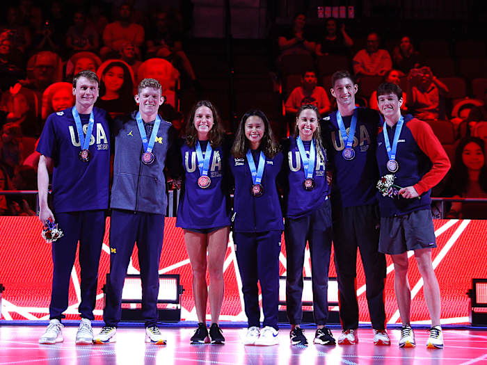 Brooke Forde (third from left) poses with teammates, from left: Bowe Becker, Patrick Callan, Bella Sims, Catie Deloof, Hunter Armstrong and Jake Mitchell during their medal ceremony during the 2021 U.S. Olympic Team Swimming Trials.